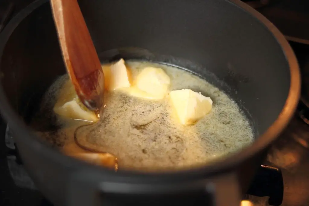 Melting butter with honey Making honey gold sauce